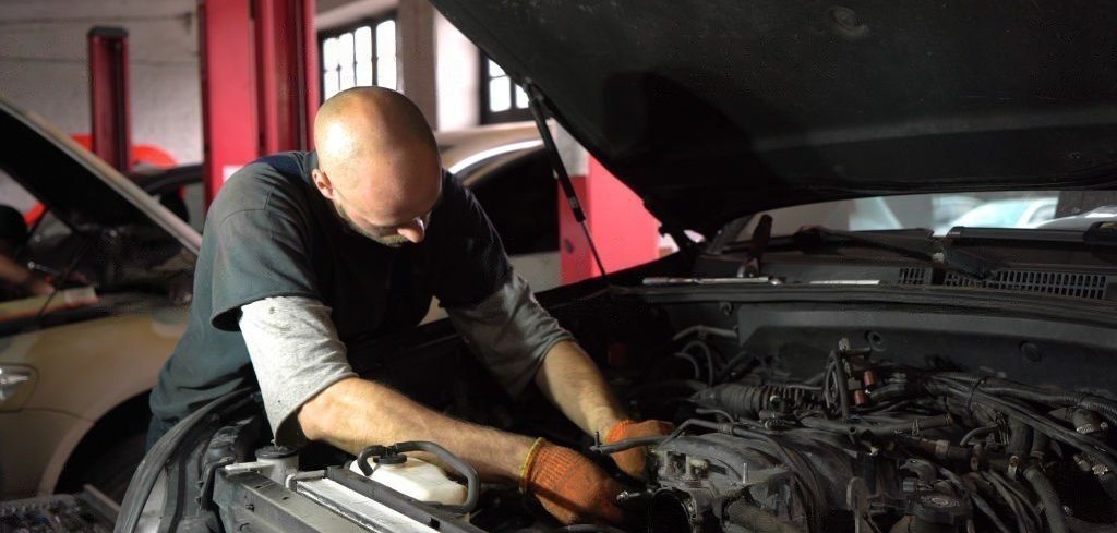auto mechanic repairs dodge car engine